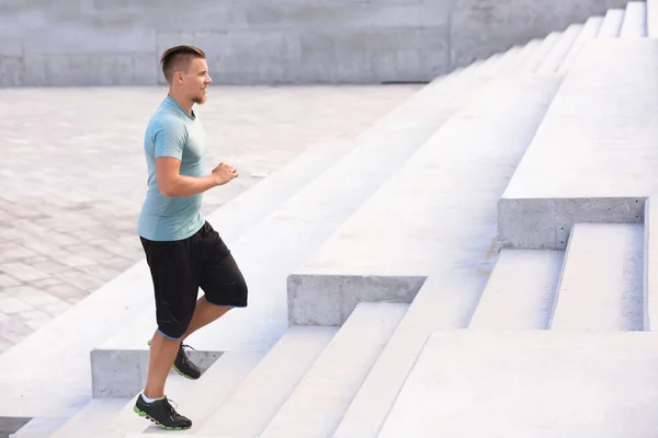 Sporty Young Man Running Outdoors — Stock Photo, Image