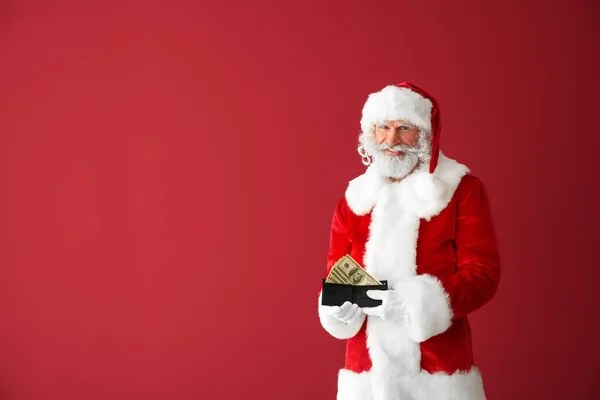 Санта Клаус Деньгами Цветном Фоне — стоковое фото