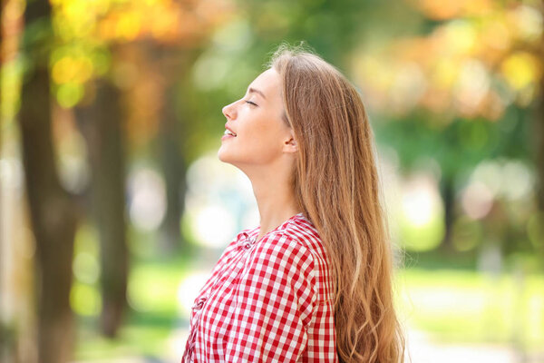 Portrait of beautiful young woman outdoors