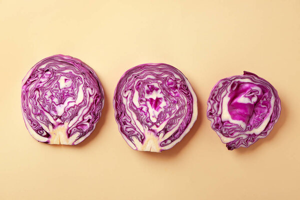Cut red cabbage on color background
