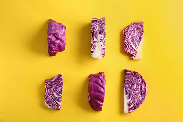 Cut red cabbage on color background