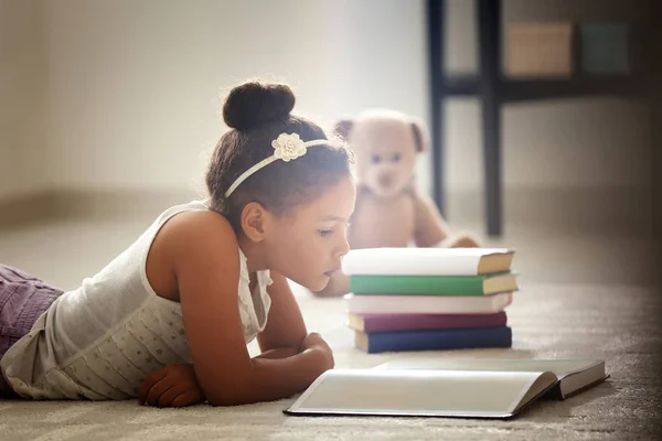 Little African American Girl Reading Book While Lying Floor Home — Stock Photo, Image