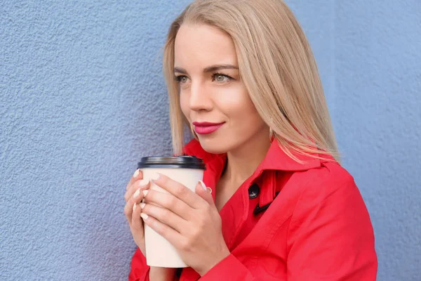 Beautiful Young Woman Stylish Red Coat Drinking Coffee Color Wall — Stock Photo, Image