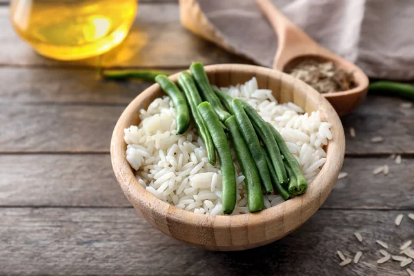 Bowl Tasty Boiled Rice Green Beans Wooden Table — Stock Photo, Image