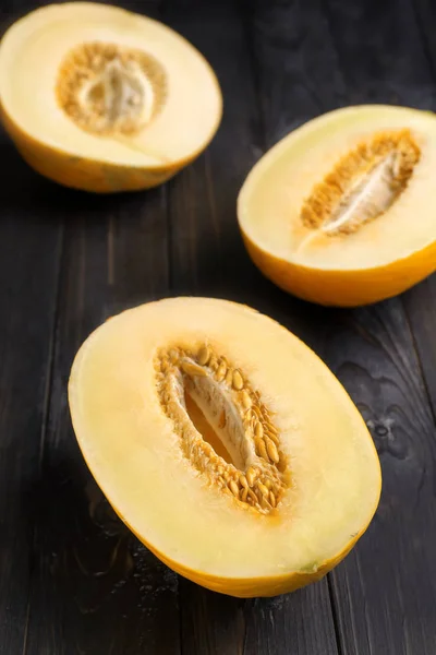 Halves Ripe Sweet Melon Dark Wooden Table — Stock Photo, Image