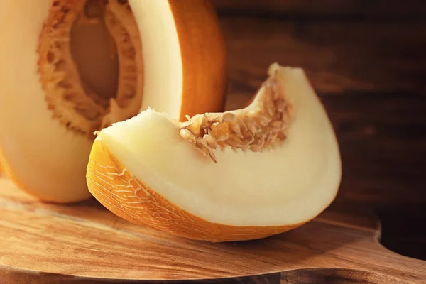 Ripe sliced melon on board, closeup