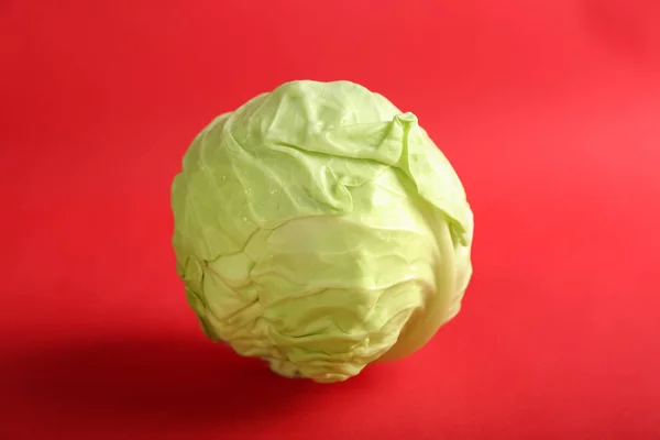 Fresh cabbage on color background