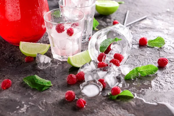 Glasses Ice Cubes Raspberries Lime Grey Table — Stock Photo, Image