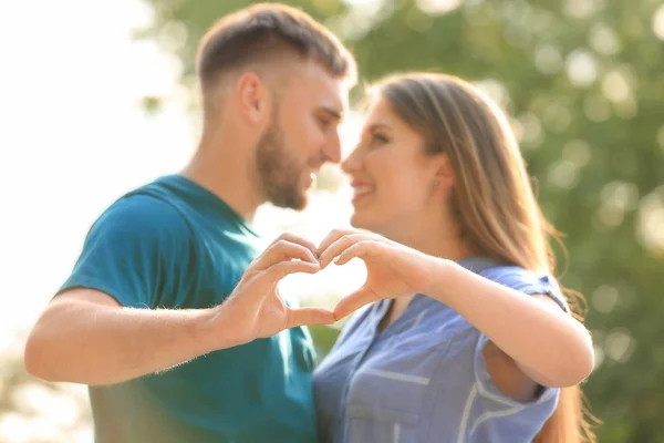 Happy Couple Making Heart Hands Outdoors — Stock Photo, Image