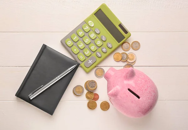 Cute Piggy Bank Coins Notebook Calculator Wooden Table — Stock Photo, Image