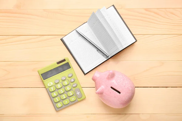 Cute Piggy Bank Notebook Calculator Wooden Table — Stock Photo, Image