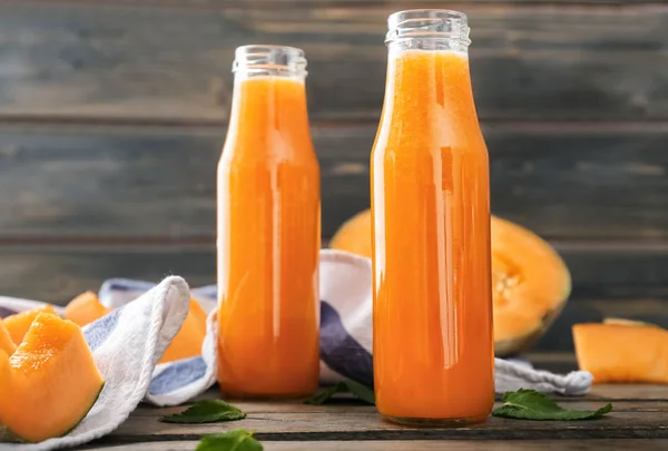 Bottles Tasty Melon Smoothie Wooden Table — Stock Photo, Image