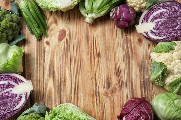 Composition with different types of cabbage on wooden background — Stock Image Composition Different Types Cabbage Wooden Background Stock Picture