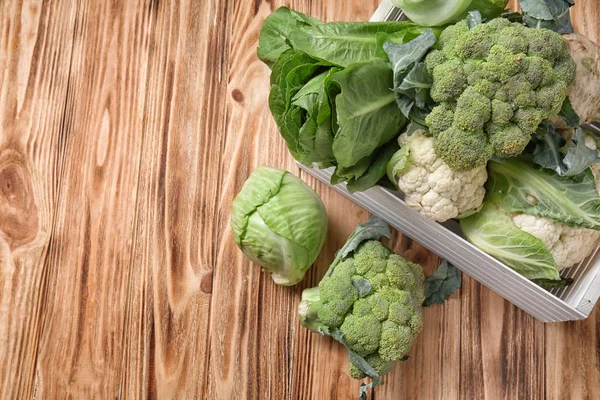 Crate with different types of cabbage on wooden background — Stock Image Crate Different Types Cabbage Wooden Background Royalty Free Stock Photos