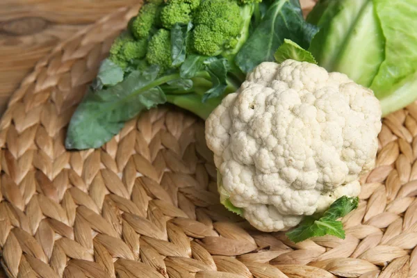 Different types of cabbage on wicker mat — Stock Image Different Types Cabbage Wicker Mat Stock Picture