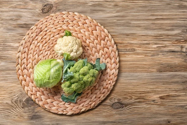 Different types of cabbage on wicker mat — Stock Image Different Types Cabbage Wicker Mat Stock Picture