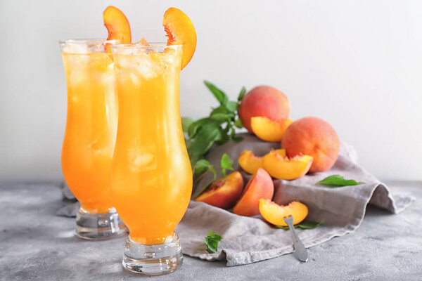 Fresh summer cocktail in glasses on grey table