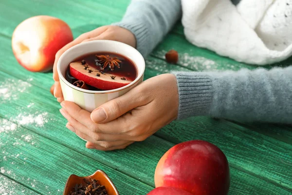 Woman Holding Cup Delicious Mulled Wine Color Wooden Table Closeup — Stock Photo, Image