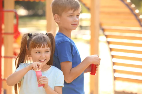 Cute Little Children Blowing Soap Bubbles Outdoors — Stock Photo, Image