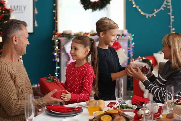 Happy Family Giving Each Other Presents Christmas Dinner Home — Stock Photo, Image