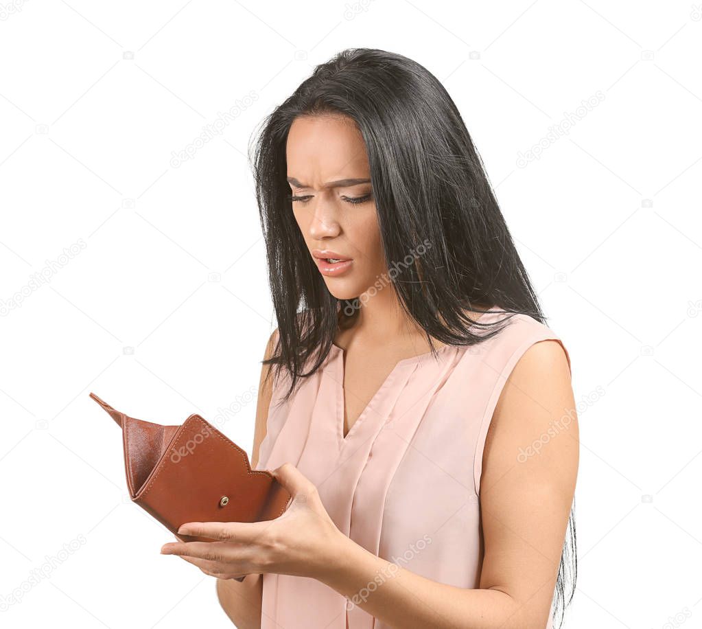 Young woman with empty wallet on white background