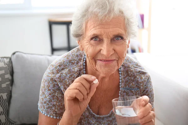 Senior Woman Taking Medicine Home — Stock Photo, Image