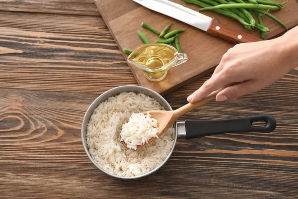 Woman Saucepan Full Tasty Rice — Stock Photo, Image