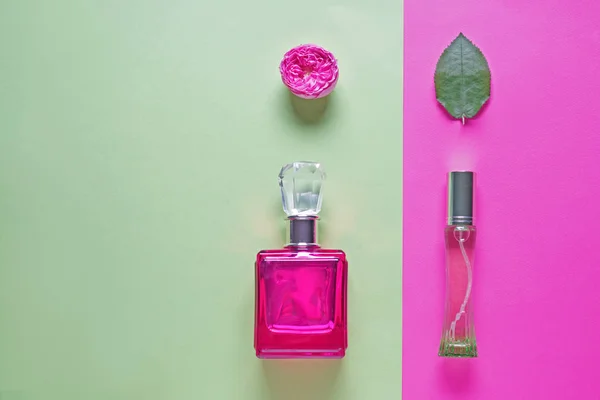 Beautiful composition with bottles of perfume on color background