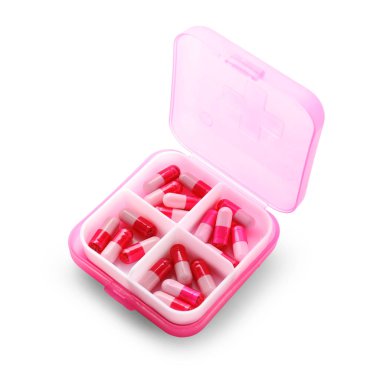 Beyaz arka plan üzerinde haplarla Plastik Konteyner