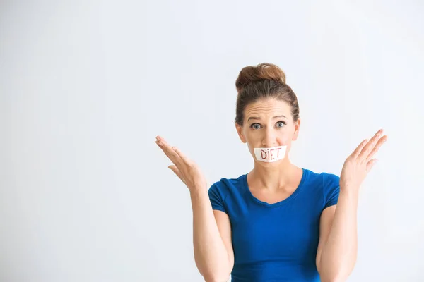 Emotional Woman Taped Mouth White Background Diet Concept — Stock Photo, Image