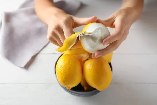 Woman Peeling Ripe Lemons White Wooden Table Closeup — Stock Photo, Image