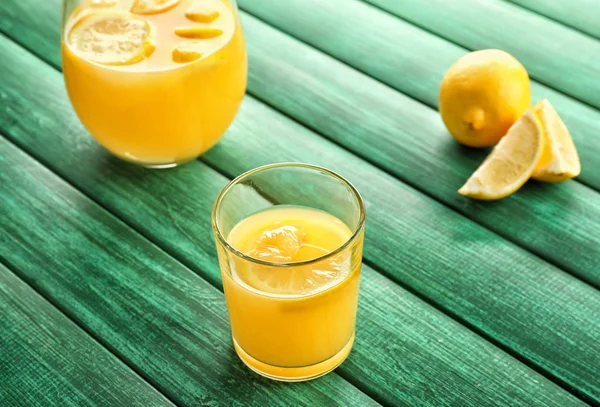 Glass Jug Fresh Lemon Juice Color Wooden Table — Stock Photo, Image