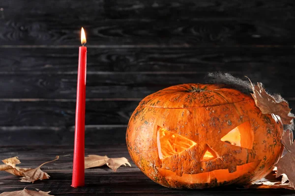 Halloween Pumpkin Burning Candle Dark Wooden Background — Stock Photo, Image