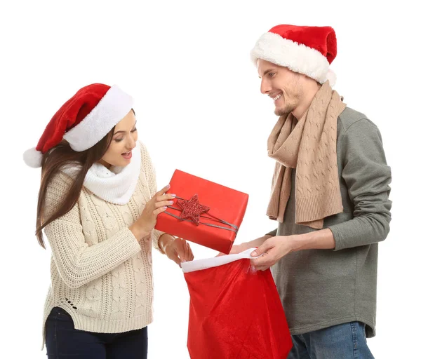 Young Woman Choosing Gift Christmas Bag Held Her Husband White — Stock Photo, Image