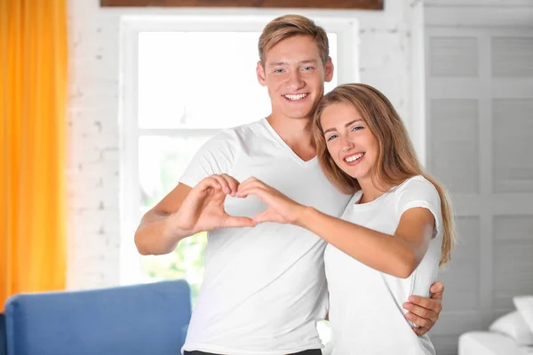 Young Couple Holding Hands Shape Heart Home — Stock Photo, Image