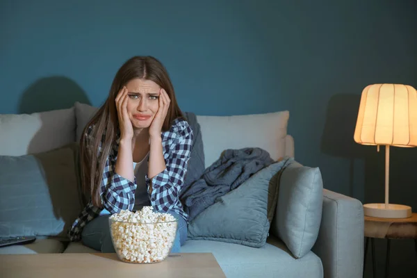 Emotional Young Woman Eating Popcorn While Watching Late Evening — Stock Photo, Image