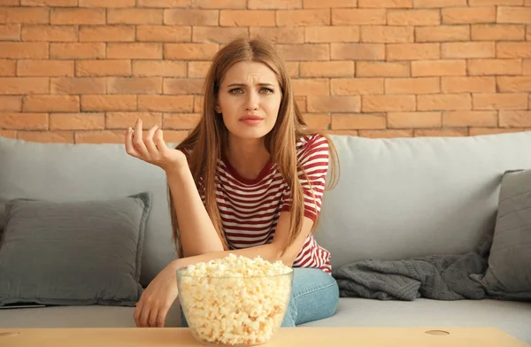 Emotional Young Woman Eating Popcorn While Watching Home — Stock Photo, Image