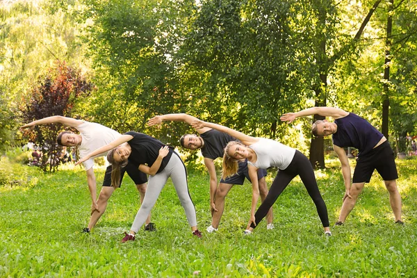 Sporty Young People Training Outdoors — Stock Photo, Image