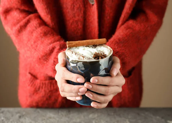 Woman with cup of tasty cocoa and marshmallows, closeup