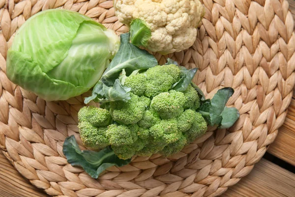 Different types of cabbage on wicker mat — Stock Image Different Types Cabbage Wicker Mat Royalty Free Stock Images