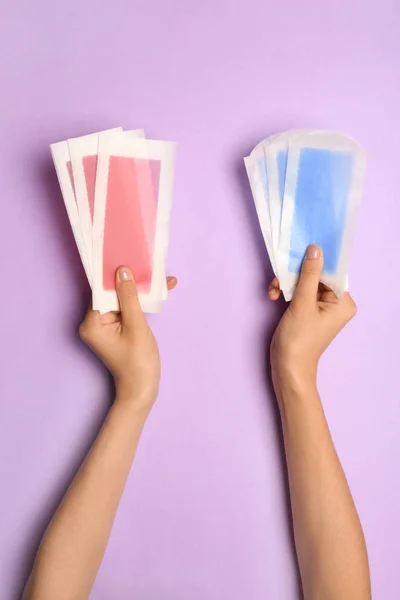 Woman Holding Different Wax Strips Color Background — Stock Photo, Image