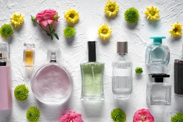 Flat Lay Composition Bottles Perfume Flowers White Textured Background — Stock Photo, Image