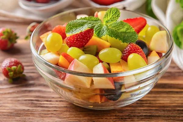 Bowl Delicious Fruit Salad Mint Wooden Table — Stock Photo, Image