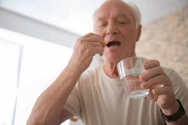 Senior Man Taking Medicine Home — Stock Photo, Image