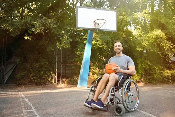 Sporty Young Man Ball Sitting Wheelchair Outdoors — Stock Photo, Image