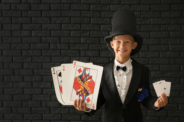 Cute Little Magician Cards Dark Brick Wall — Stock Photo, Image