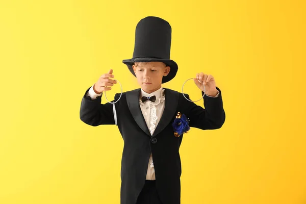Cute Little Magician Showing Trick Rings Color Background — Stock Photo, Image