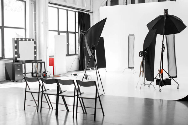 Interior of modern photo studio with professional equipment