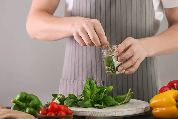 Woman Putting Fresh Green Basil Glass Jar Table — Stock Photo, Image