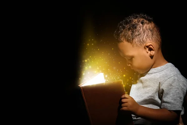 Little African American Boy Reading Magic Book Dark Background — Stock Photo, Image